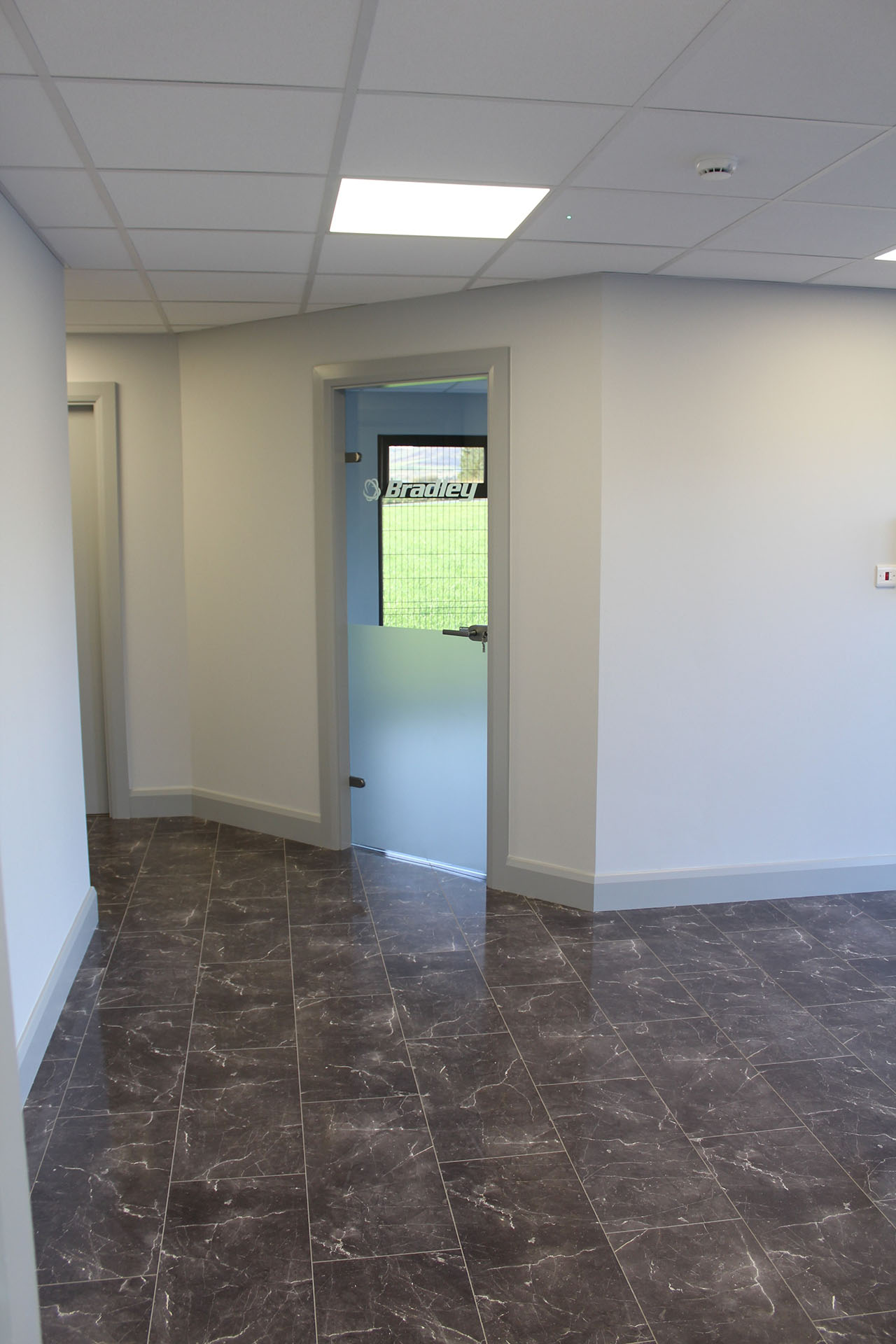 Bradley Group modular office white interior with grey tiles