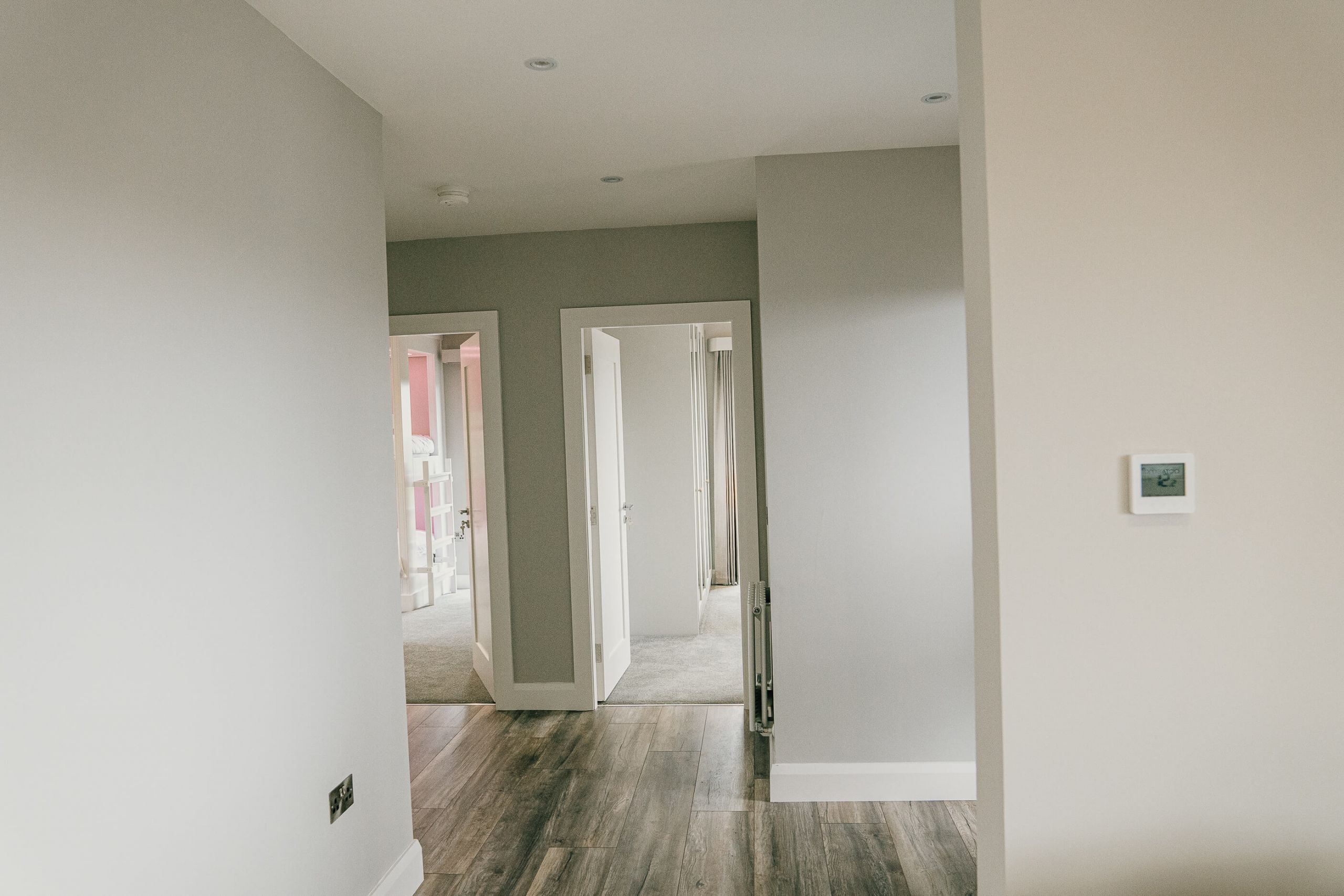 hall way grey walls oak floors turnkey modular home