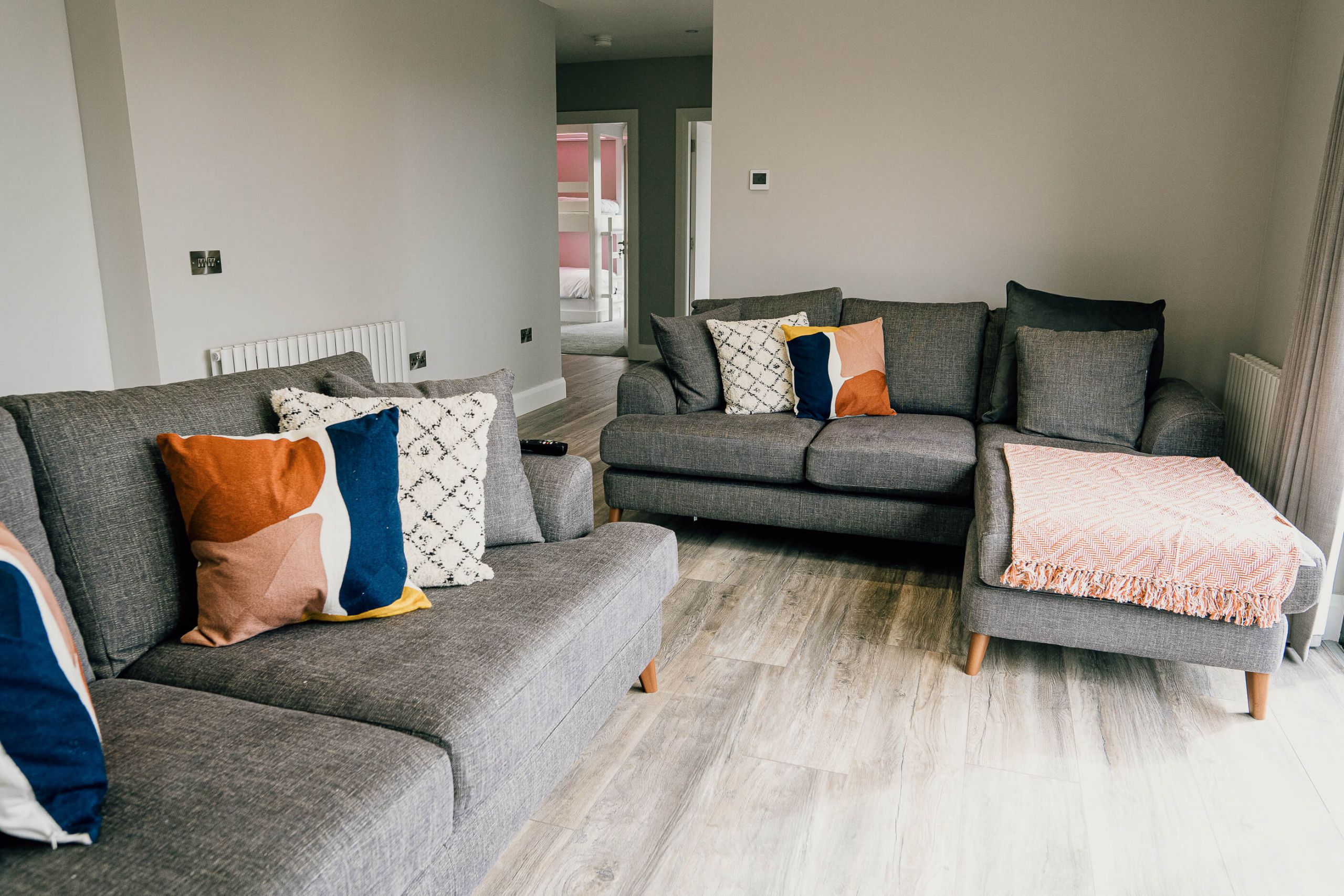 Modular Holiday Home living area turn key grey sofa modular home